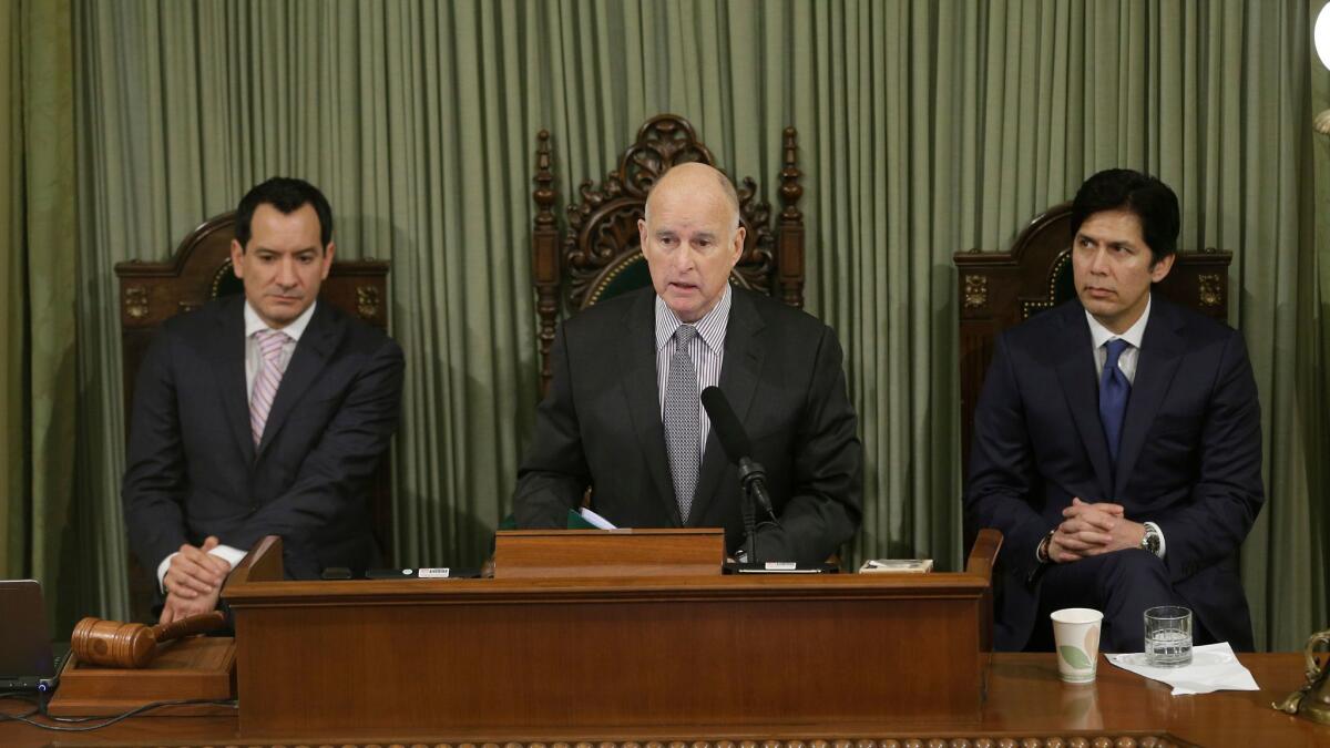 Gov. Jerry Brown, flanked by Assembly Speaker Anthony Rendon (left) and Senate President Pro Tem Kevin de León, delivers his final State of the State address in Sacramento on Jan. 24.