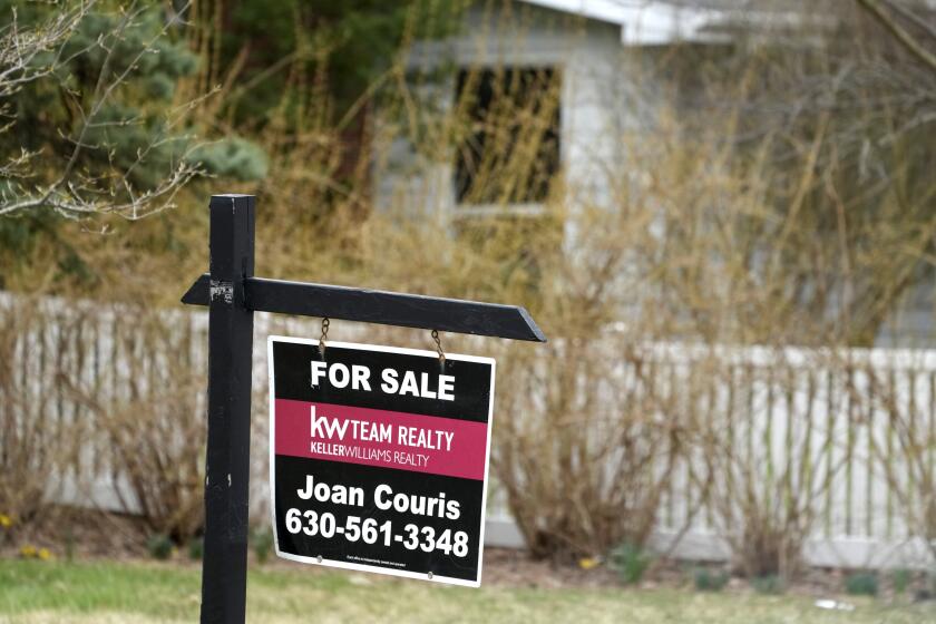 A "for sale" sign is displayed in front of a home in Mount Prospect, Ill., Monday, March 18, 2024. On Thursday, March 21, 2024, the National Association of Realtors reports on existing home sales for February. (AP Photo/Nam Y. Huh)