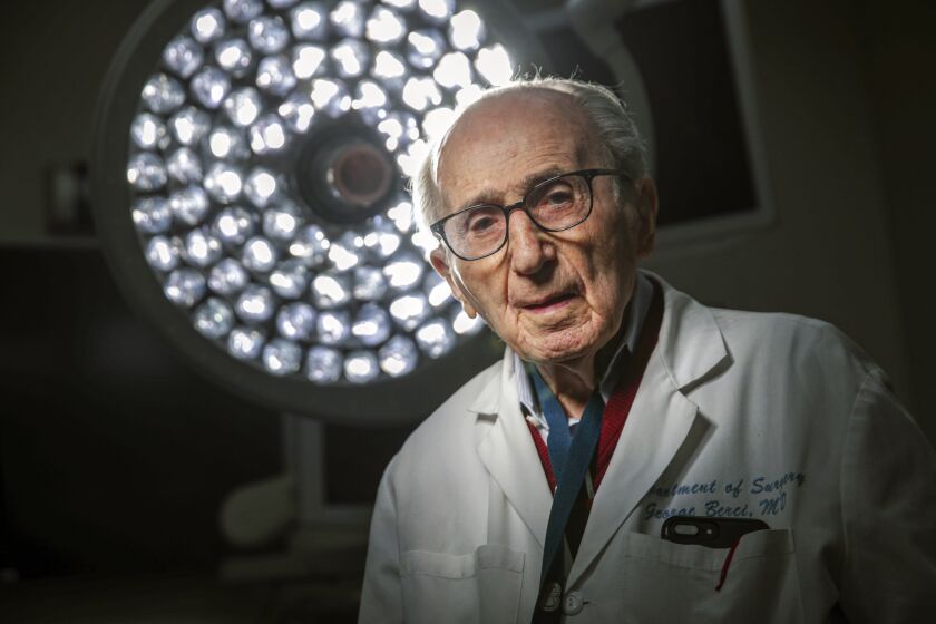 Los Angeles, CA - March 08: Dr. George Berci, holocaust survivor and surgical pioneer, is a surgeon at Cedars-Sinai Medical Center on Tuesday, March 8, 2022 in Los Angeles, CA. (Irfan Khan / Los Angeles Times)