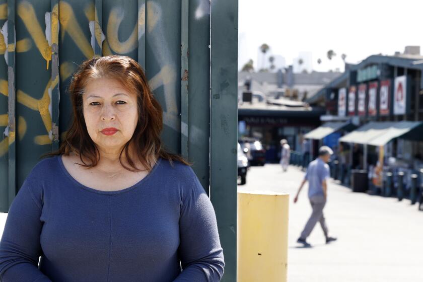 LOS ANGELES-CA-AUGUST 14, 2023: Antonia Gonzalez, who works at Hannam Chain in Korea-town, is photographed outside the grocery store on August 14, 2023. (Christina House / Los Angeles Times)