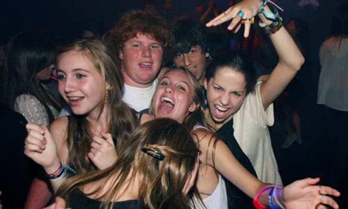 Teenagers have some fun on the dance floor of the Roxy during the "Spin The Bottle" dance party in West Hollywood