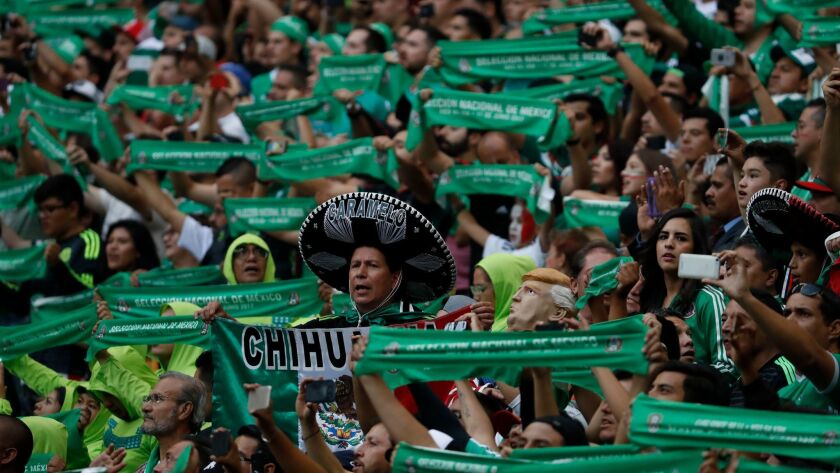 Mexican fans cheer their team at a World Cup soccer qualifying match against the United States in Mexico City on June 11.