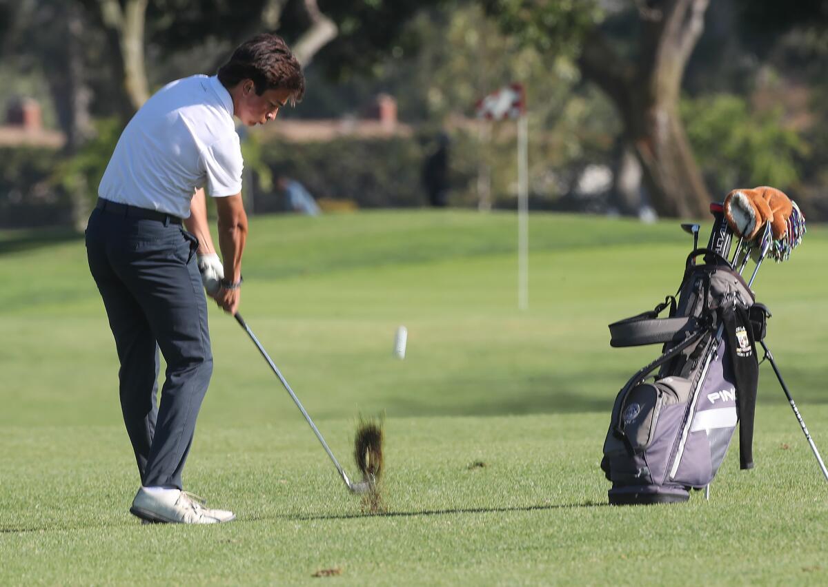 Newport Harbor's Tyler Richardson hits a chip to the pin against Corona del Mar on Wednesday at Costa Mesa Country Club.