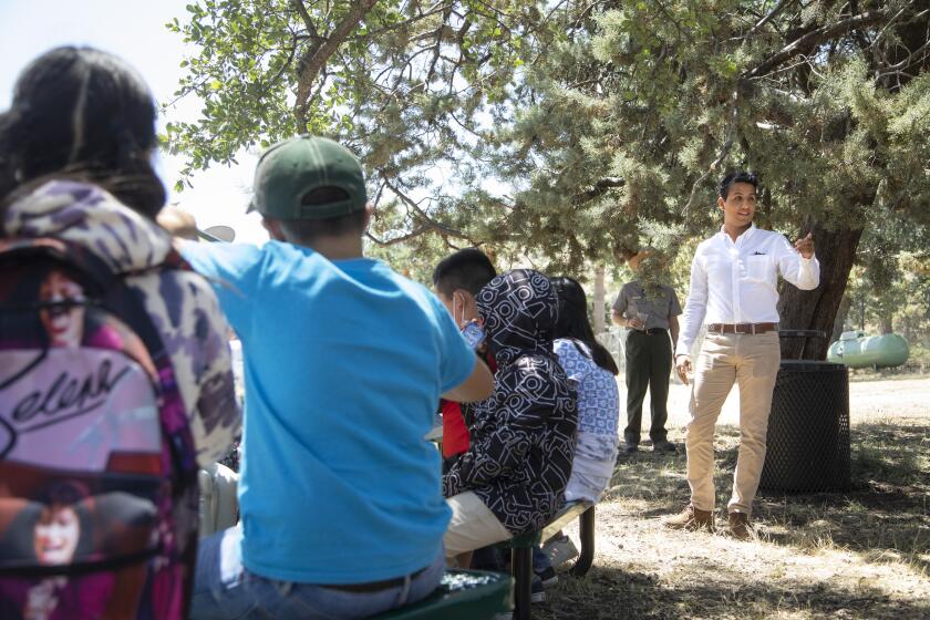 KEENE, CA - MAY 24: Andres Chavez, the grandson of Cesar Chavez and the executive director of the National Chavez Center in Keene, speaks with schoolchildren on a field trip to the Cesar E. Chavez National Monument in Keene. He is in charge of shaping his grandfather's legacy. Photographed on Tuesday, May 24, 2022. (Myung J. Chun / Los Angeles Times)