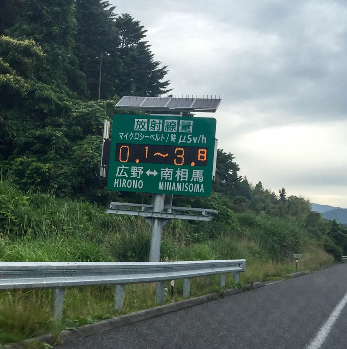 A roadside sign installed by the Japanese government south of the Fukushima Daiichi nuclear plant displays radiation readings.