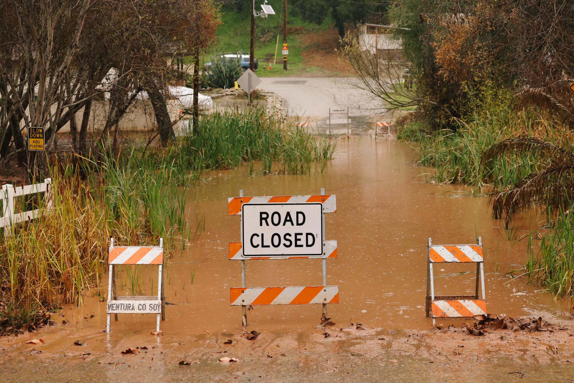 Flooding is seen along Camp Chafee Road at Casitas Vista Road on Sunday in Ventura, California