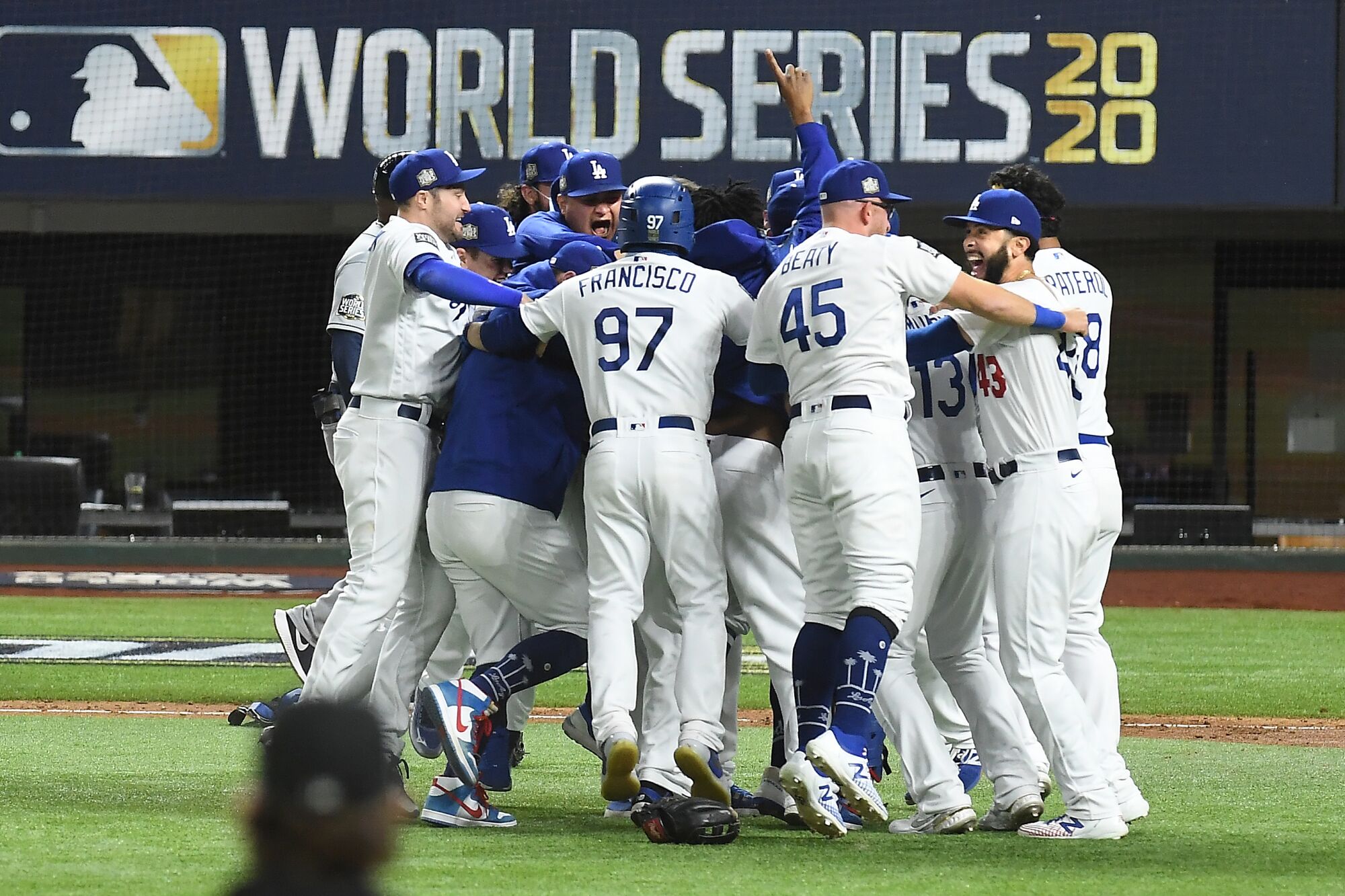 Dodgers players celebrate after defeating the Tampa Bay Rays in Game 6 of the World Series.