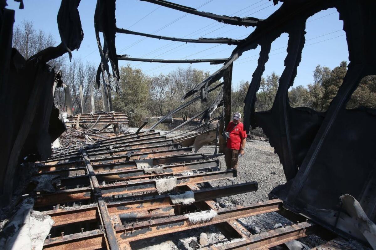 Diablo Bowman Archery Club member Cleon Winter surveys damage to one of the club's storage trailers along a fire road near the north peak of Mt. Diablo in unincorporated Contra Costa County near Clayton, Calif.