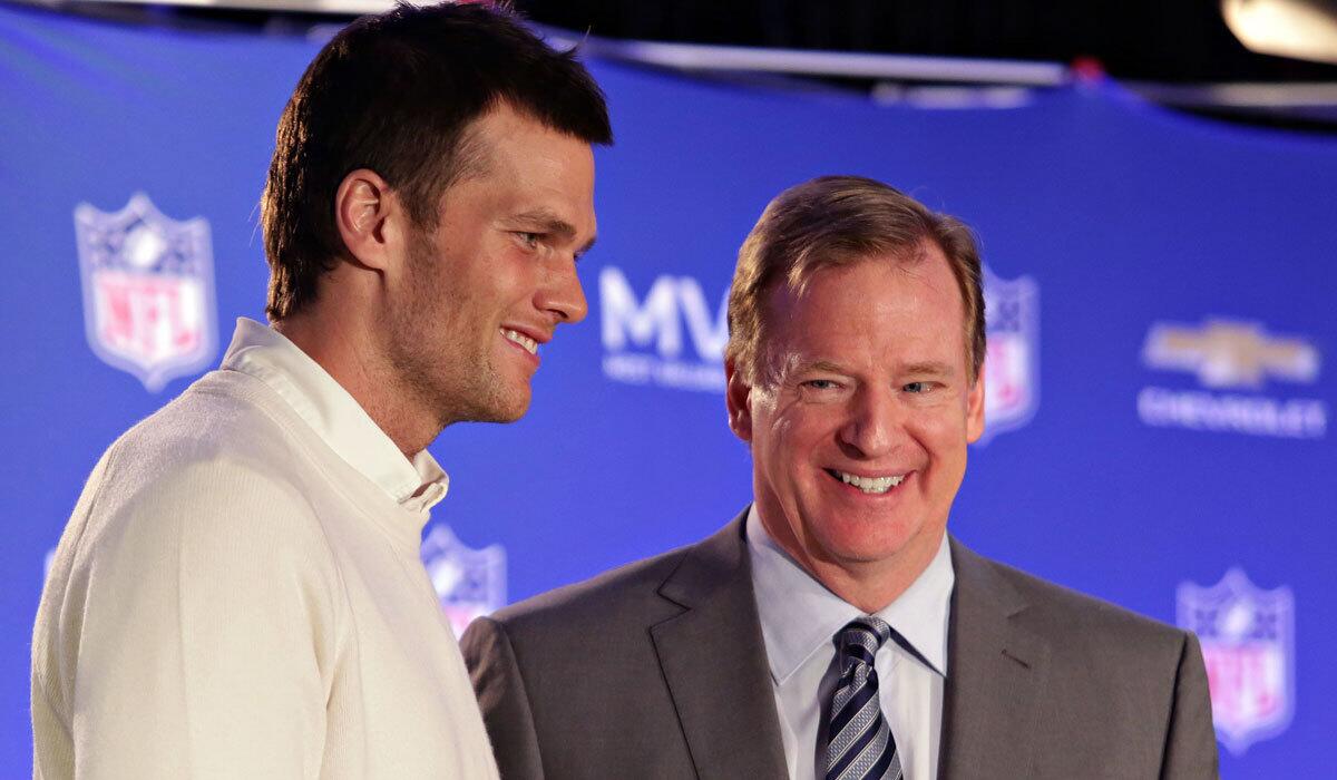 NFL Commissioner Roger Goodell, right, presents New England quarterback Tom Brady with the Super Bowl MVP trophy in February.