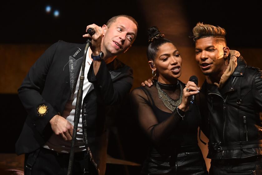 LOS ANGELES, CALIFORNIA JANUARY 21, 2020-Coldplay lead singer Chris Martin performs with his back up singers during a benefit concert at the Palladium Monday night. (Wally Skalij/Los Angeles Times)