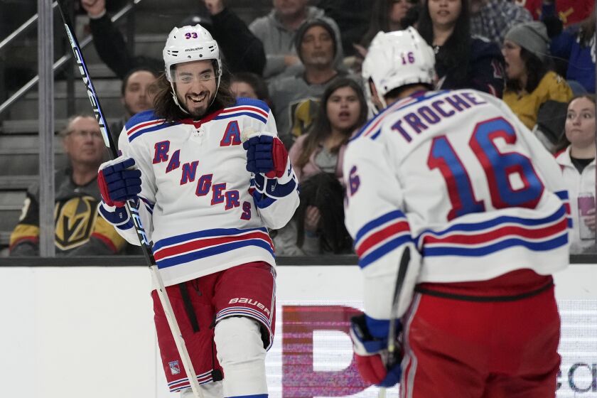 New York Rangers center Mika Zibanejad (93) celebrates after scoring against the Vegas Golden Knights during the third period of an NHL hockey game Wednesday, Dec. 7, 2022, in Las Vegas. (AP Photo/John Locher)