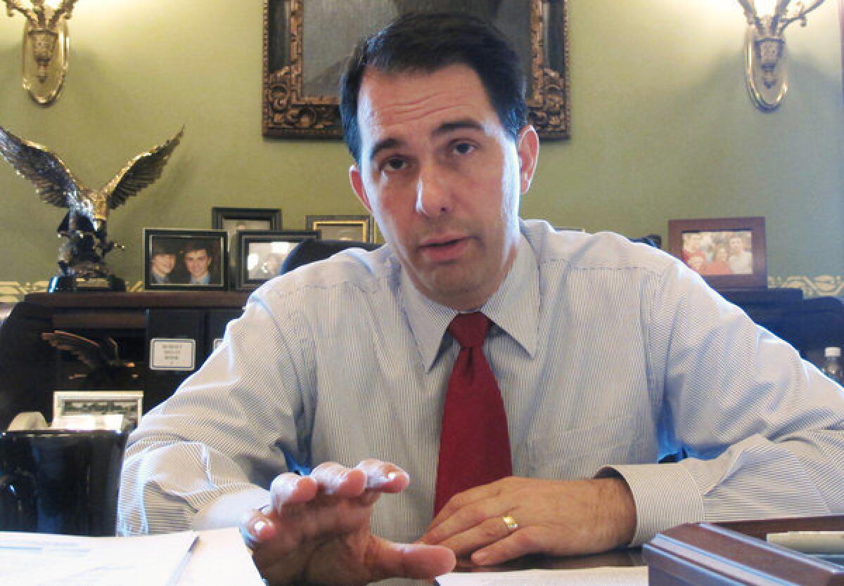 Last month, Wisconsin Gov. Scott Walker signed legislation restricting abortions. Above, Walker in June.