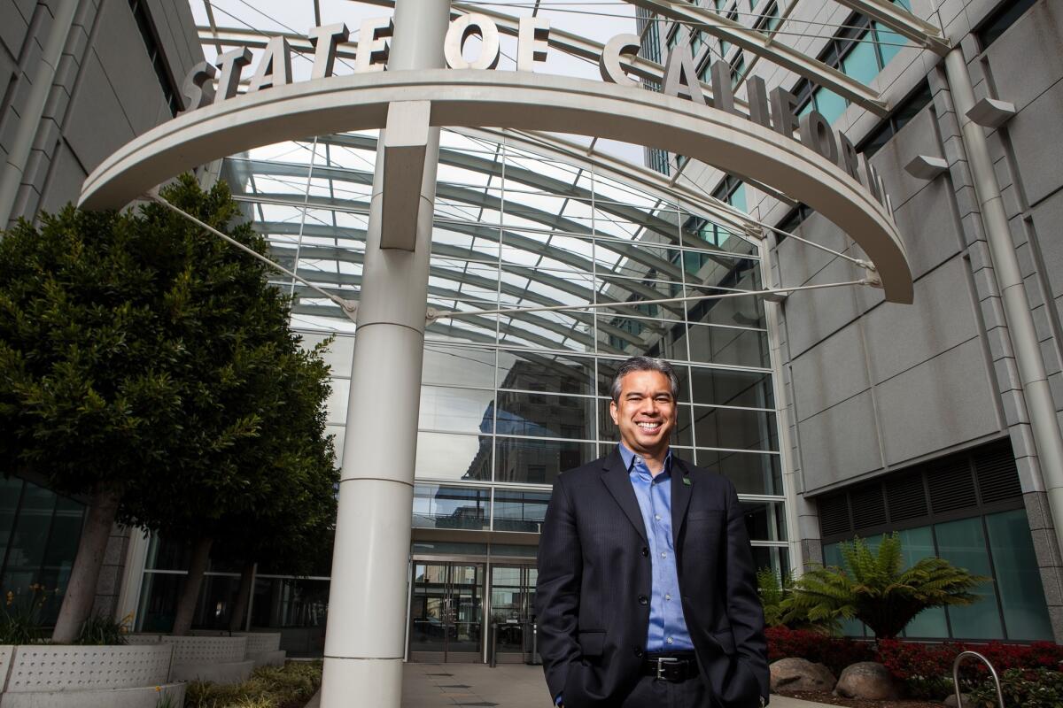 Rob Bonta smiles for a portrait.