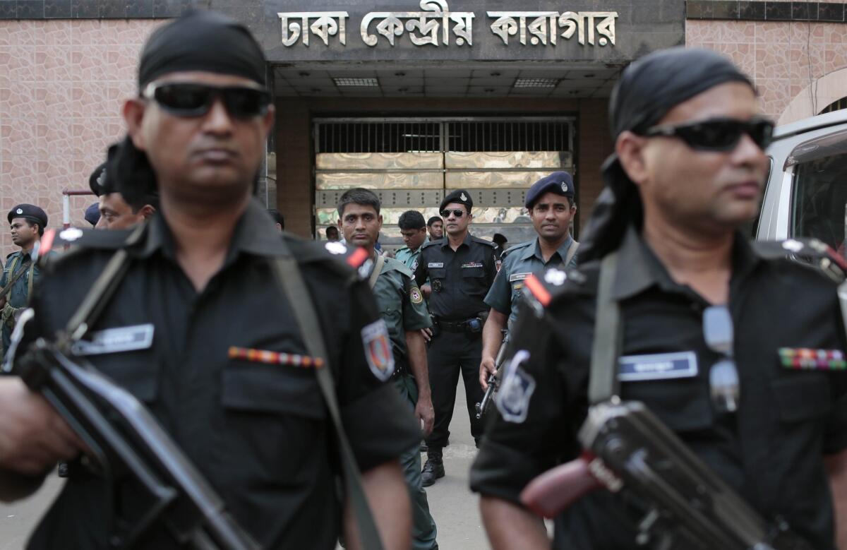 Bangladeshi security personnel stand guard April 11 outside the central jail in Dhaka where Muhammad Kamaruzzaman was executed late in the day.