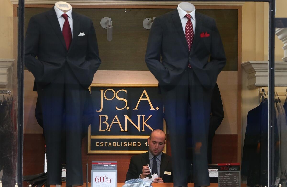 Jos. A. Bank rejected a takeover offer from rival Men's Wearhouse, the company announced Monday. Above, an employee works at a San Francisco Jos. A. Bank store Dec. 5.