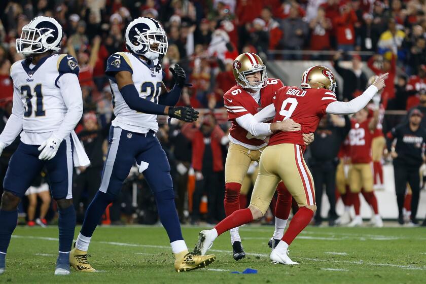 SANTA CLARA, CALIFORNIA - DECEMBER 21: Kicker Robbie Gould #9 of the San Francisco 49ers celebrates after making the game-winning field goal at the end of the fourth quarter Los Angeles Rams at Levi's Stadium on December 21, 2019 in Santa Clara, California. (Photo by Lachlan Cunningham/Getty Images)