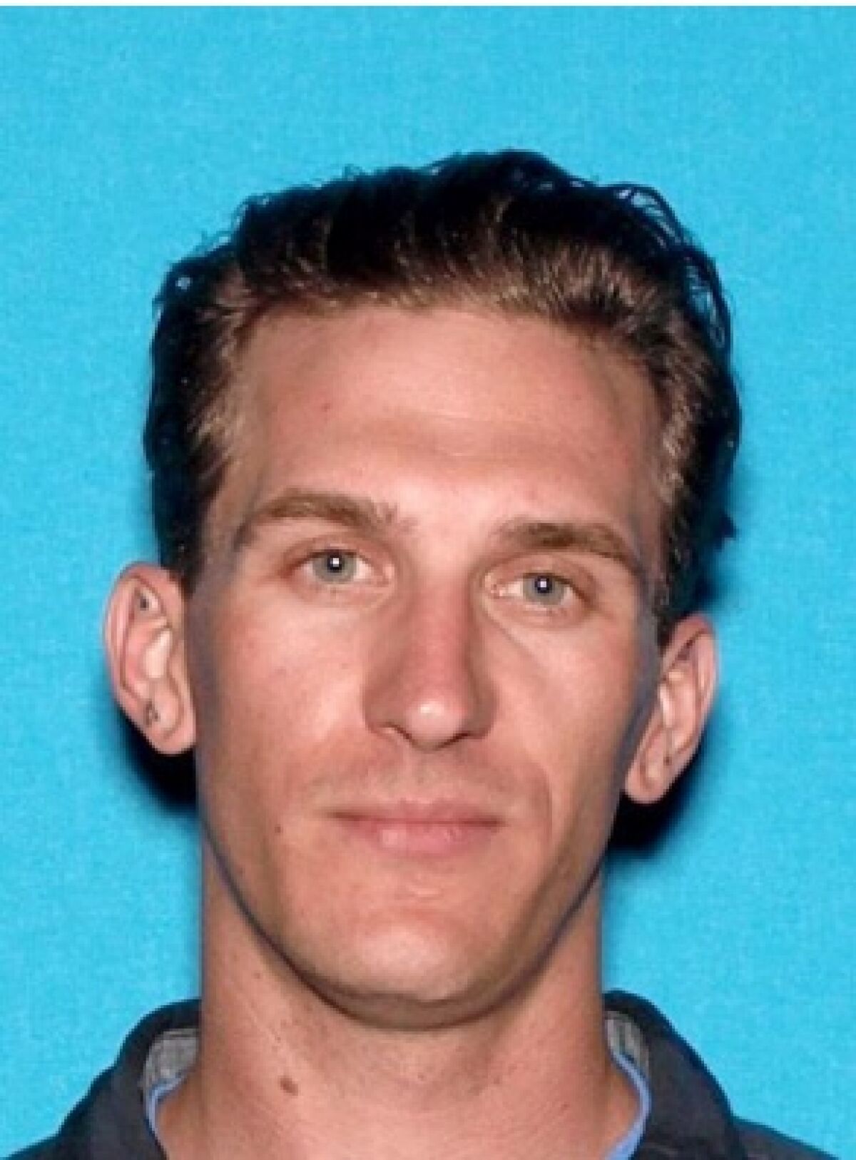 Mark Cooper, also known as "Reckless," a fugitive charged in a federal murder racketeering indictment.