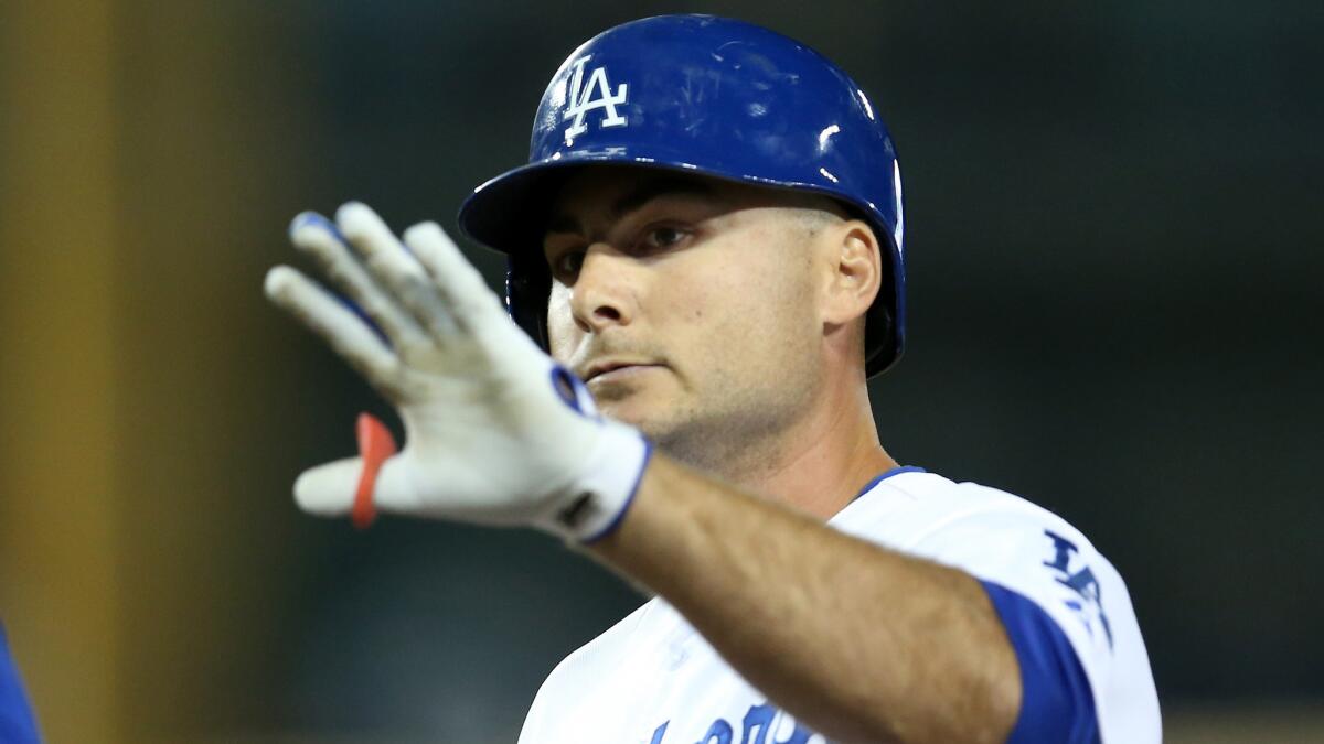 Dodgers pinch hitter Clint Robinson celebrates after hitting a run-scoring single during the team's 1-0 victory over the Cleveland Indians at Dodger Stadium on Monday.