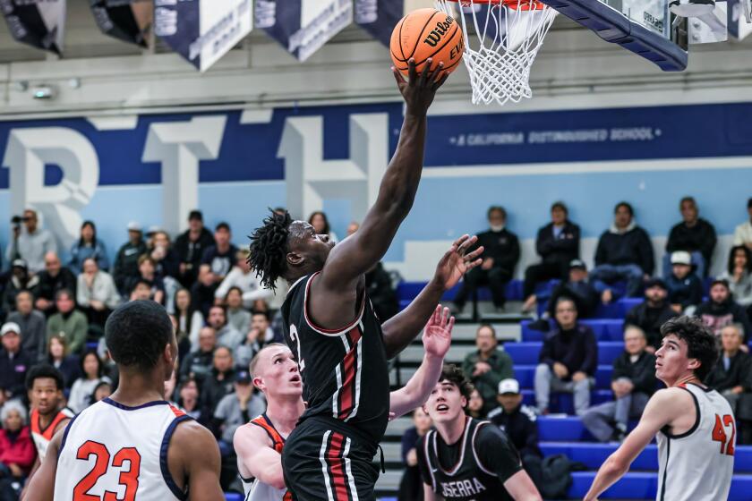 Godschoice Eboigbodin of JSerra makes shot against Rolling Hills Prep.