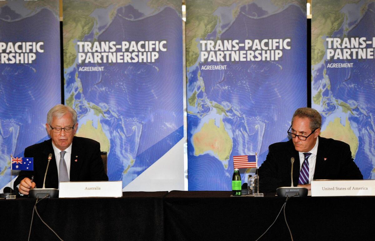 Australian Trade Minister Andrew Robb, left, and U.S. Trade Representative Mike Froman attend Trans-Pacific Partnership talks last October.