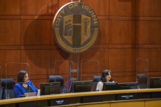 IRVINE, CA - JUNE 22: Tammy Kim Vice Mayor, left, and Farrah N. Khan Mayor, right, are participating in a Irvine City Council meeting in the Irvine City Hall Council Chambers on Tuesday, June 22, 2021 in Irvine, CA. The Irvine City Council is expected to select a site for the Veteran's Cemetery at the Great Park during its first in-person meeting in more than a year on Tuesday. Veteran's groups and residents who have been fighting to build the cemetery at the ARDA site on the former El Toro Marine Base will be showing up in significant numbers. It is expected that the council will not select the ARDA site. (Francine Orr / Los Angeles Times)