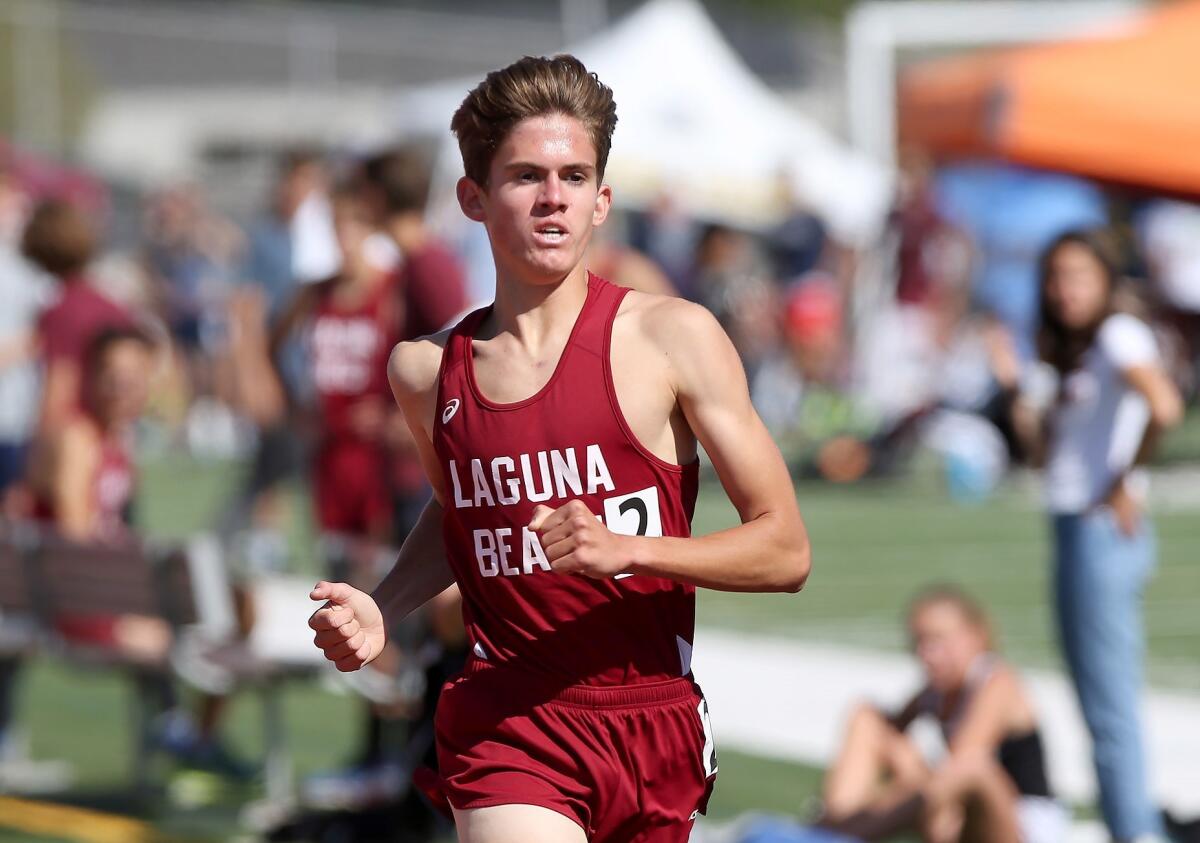 Laguna Beach's Sebastian Fisher, pictured crossing the finish line on April 25, finished the 1,600-meter race in 4 minutes 12.49 seconds in Clovis on Friday to qualify for the second day of the CIF State finals.