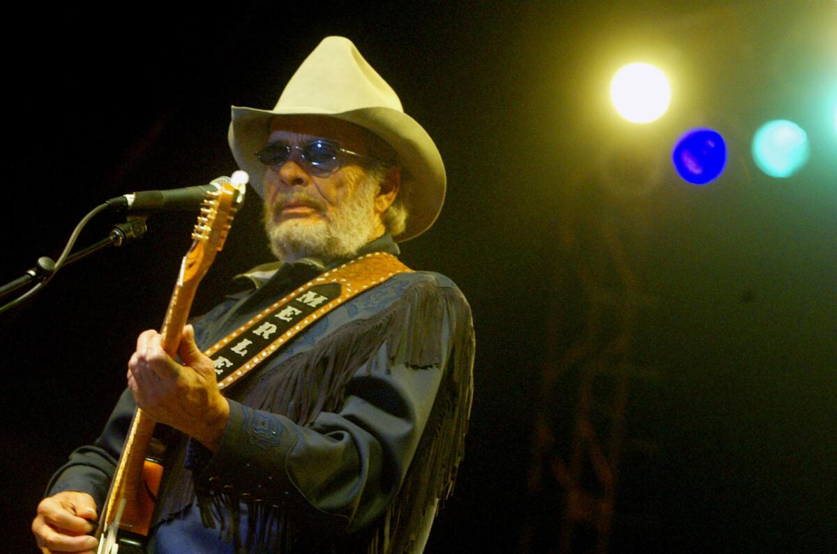 Merle Haggard performs in San Bernardino on July 8, 2003.