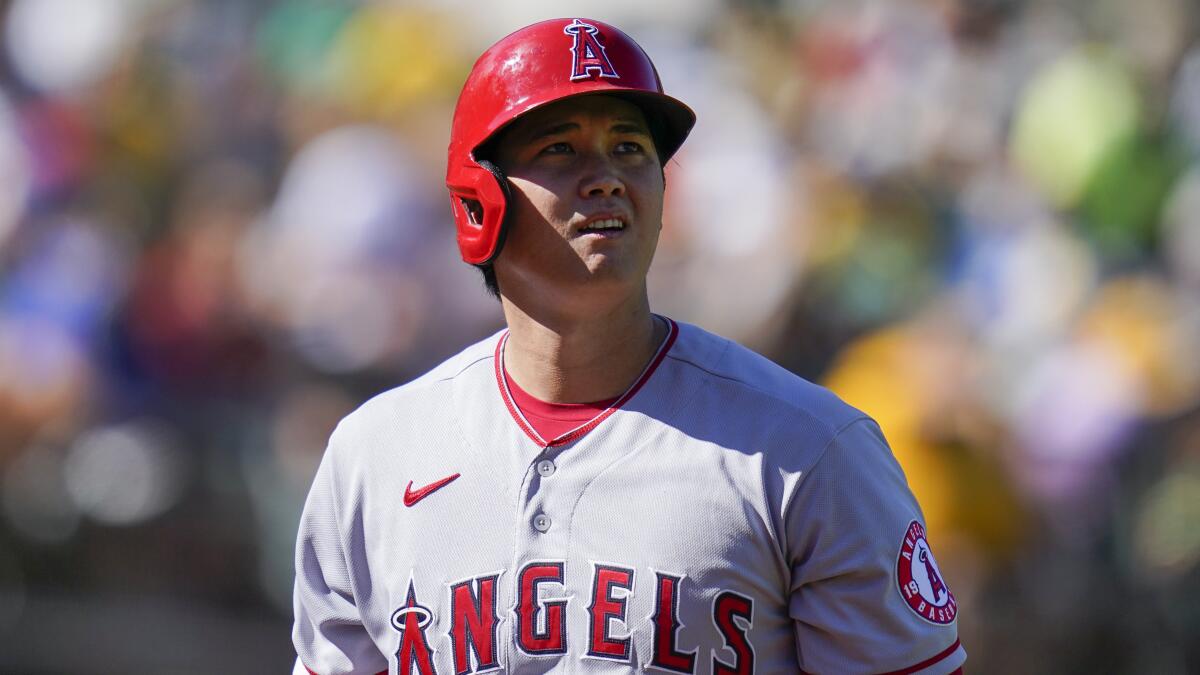 Angels' two-way star Shohei Ohtani walks to the dugout after striking out against the Oakland Athletics on Oct. 5, 2022.