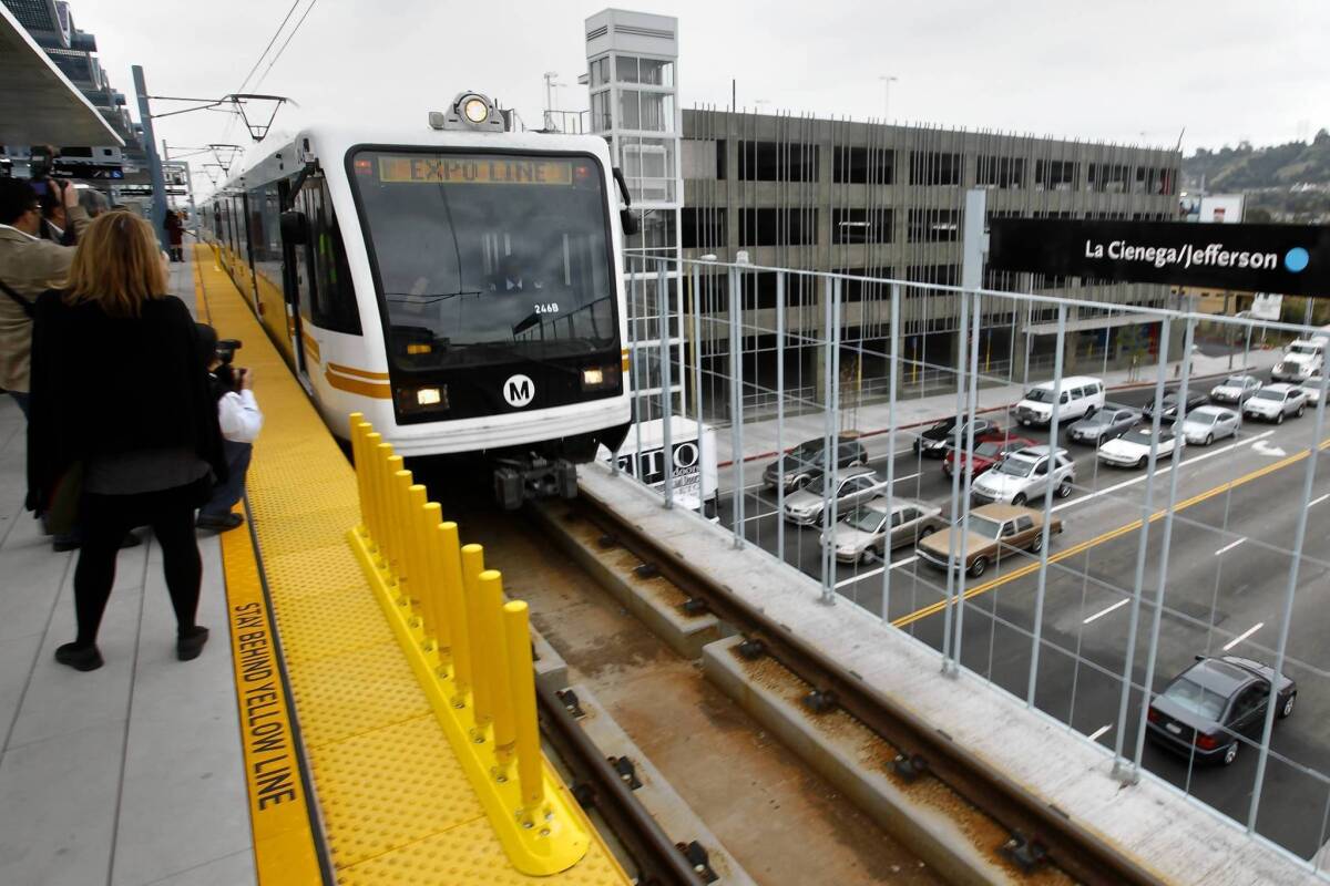 A train on Metro's Expo Line arrives at the platform of the new La Cienega/Jefferson station.