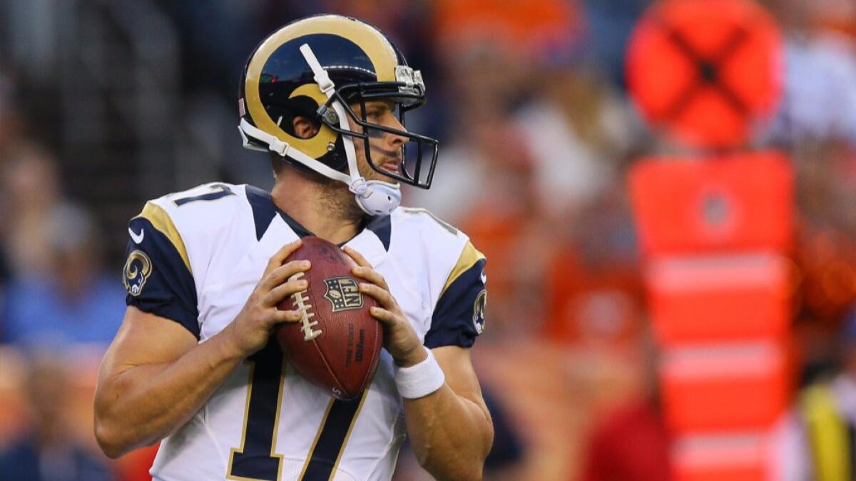 Rams quarterback Case Keenum drops back to pass against the Broncos during an exhibition game on Aug. 27.