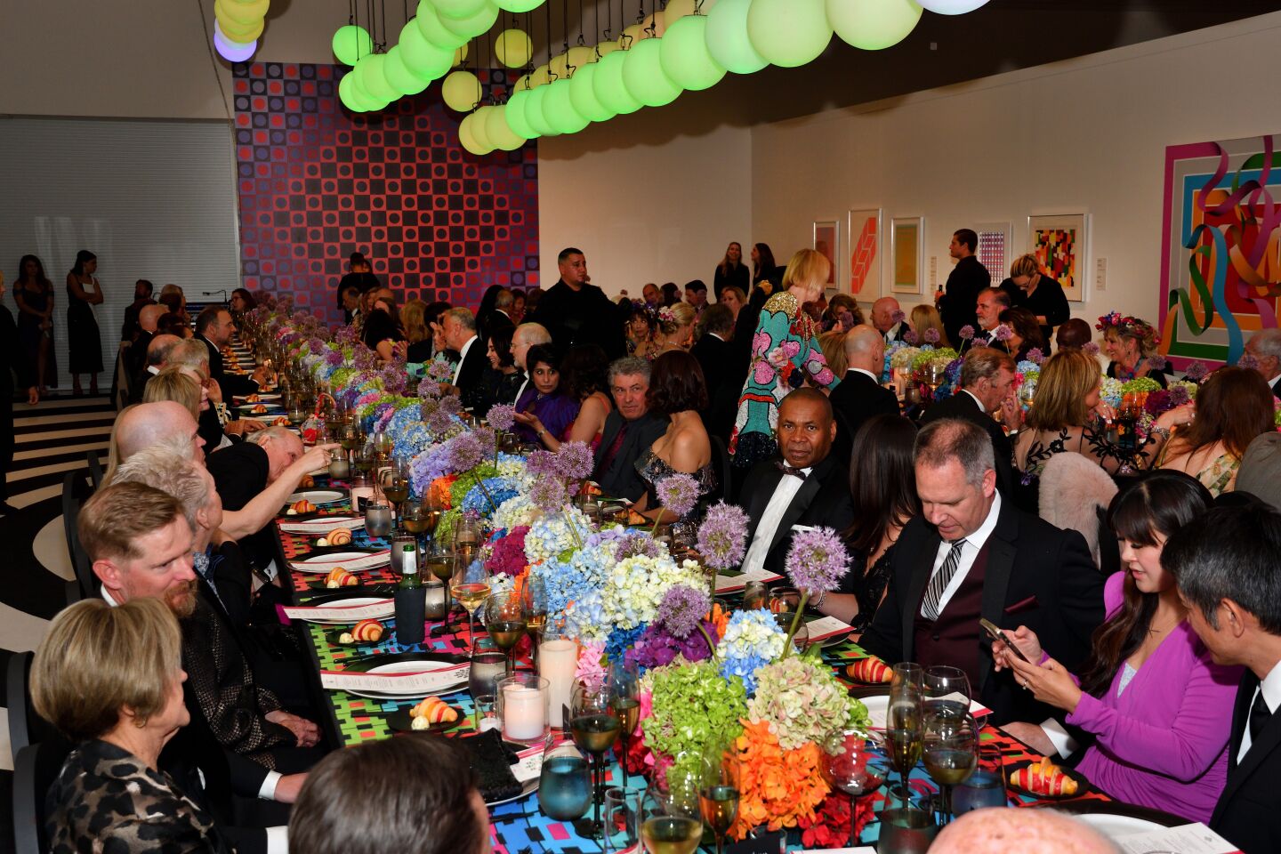 Guests sit down for dinner at the San Diego Museum of Art.