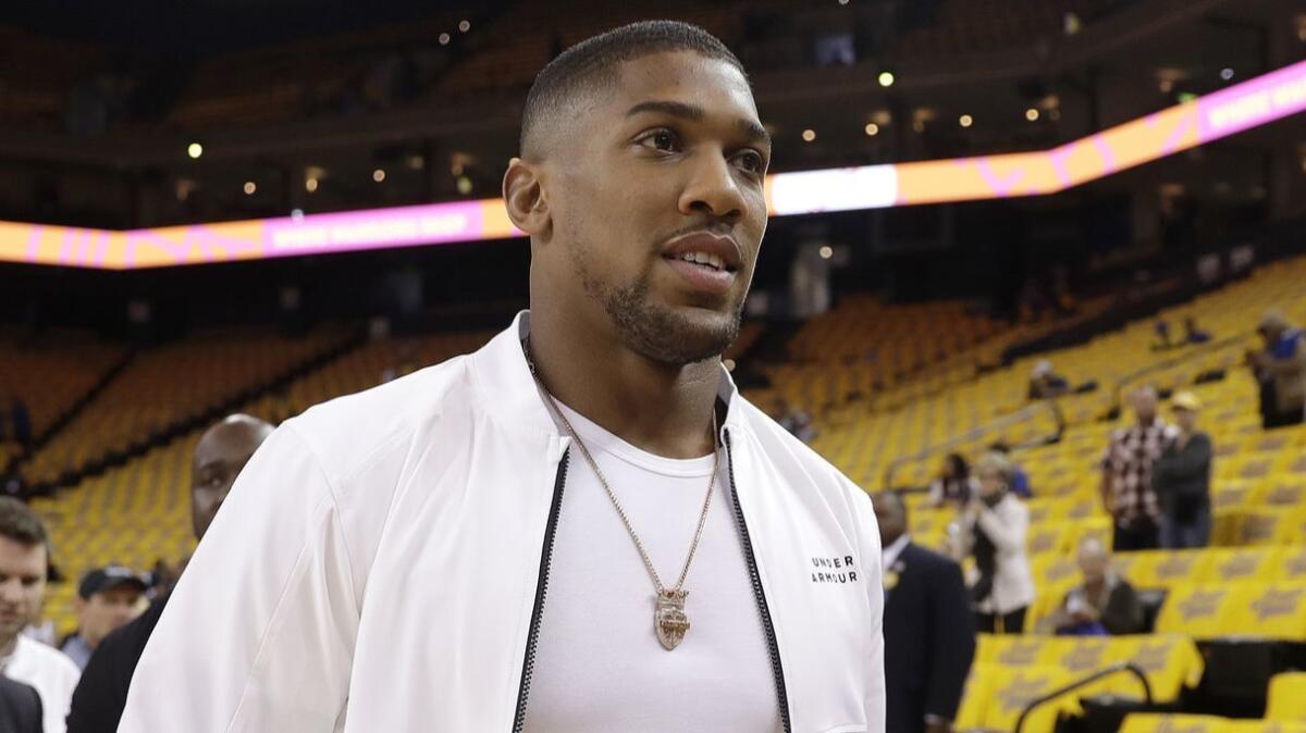 Anthony Joshua walks on the court before Game 4 of the NBA Western Conference finals between Golden State and Houston on May 22 in Oakland.
