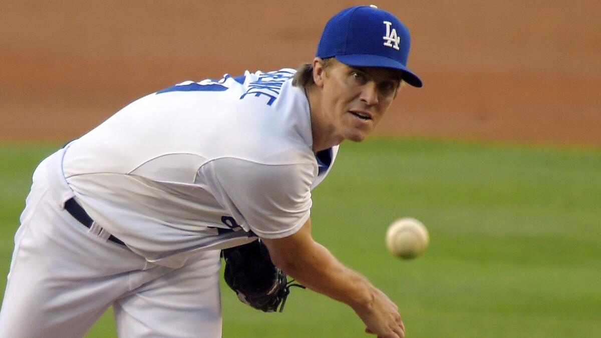 Dodgers starter Zack Greinke delivers a pitch during Saturday's victory over the New York Mets.