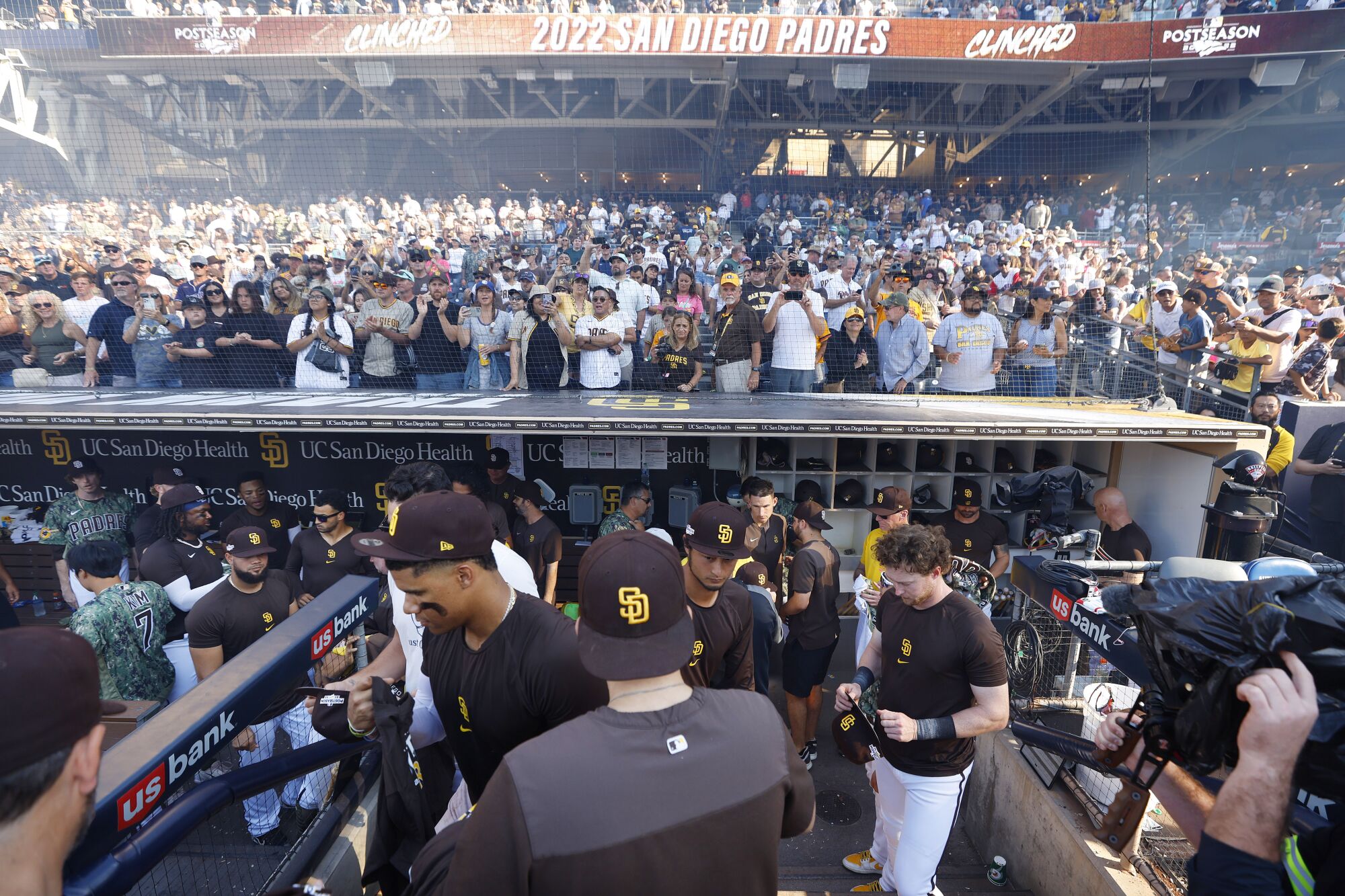 Padres players get October Rise T-Shirts to wear in a postgame celebration.