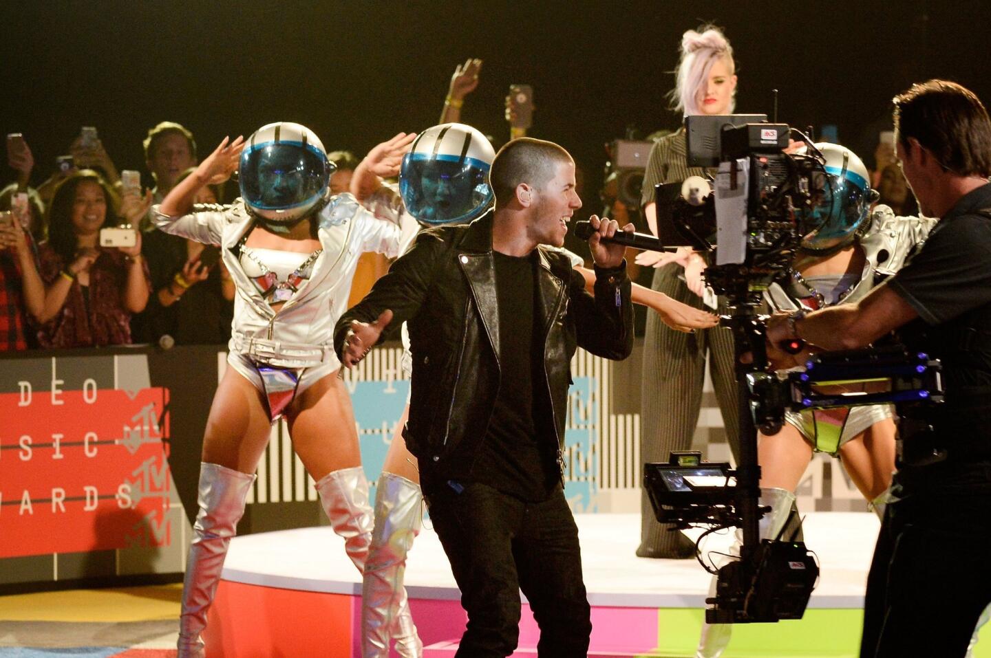 Nick Jonas performs on the red carpet during the 2015 MTV Video Music Awards at Microsoft Theater in Los Angeles on Aug. 30, 2015.