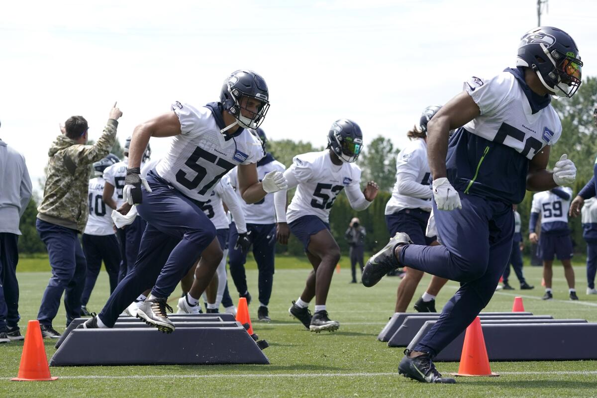 Seahawks OTAs have different feel with no Wilson, Wagner - The San