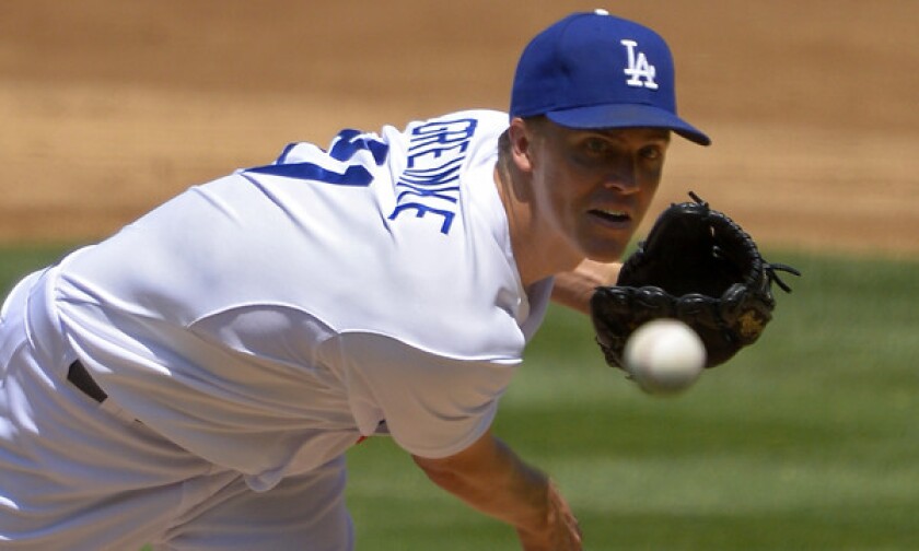 Dodgers starting pitcher Zack Greinke delivers a pitch during a game against the Tampa Bay Rays in August. Greinke pitched well against the Cleveland Indians' Class-A team in Arizona on Saturday.