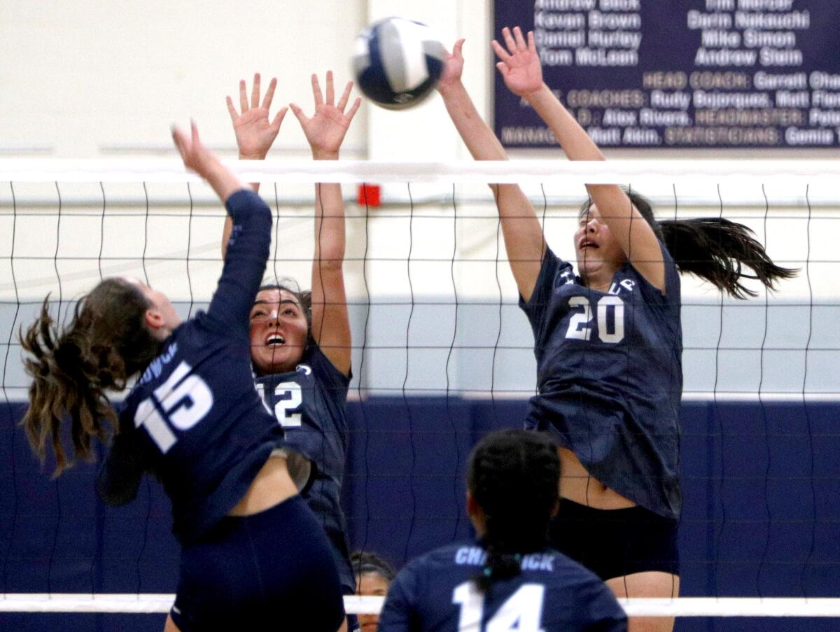 Flintridge Prep's Ani Bernardi, center, and Chase Sullivan go up for a block during Tuesday's Prep League match against Chadwick.