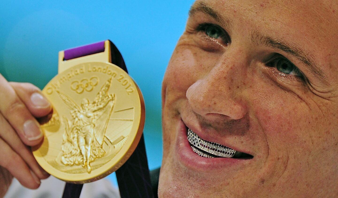 When American swimmer and fashion lover Ryan Lochte won his first gold medal, he stepped up to the podium and gave a big grin -- revealing a custom made jewel-encrusted American flag dental grill. The United States looked on, embarrassed. Lochte bared more than that when he was photographed on Vogue's June cover running arm in arm on a beach with fellow Olympians Serena Williams and Hope Solo, all clad in tasteful bathing suits. (June, July)