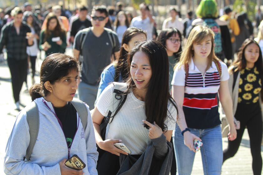 Students walk at the UCSD campus on Wednesday, November 6, 2019 in San Diego, California.