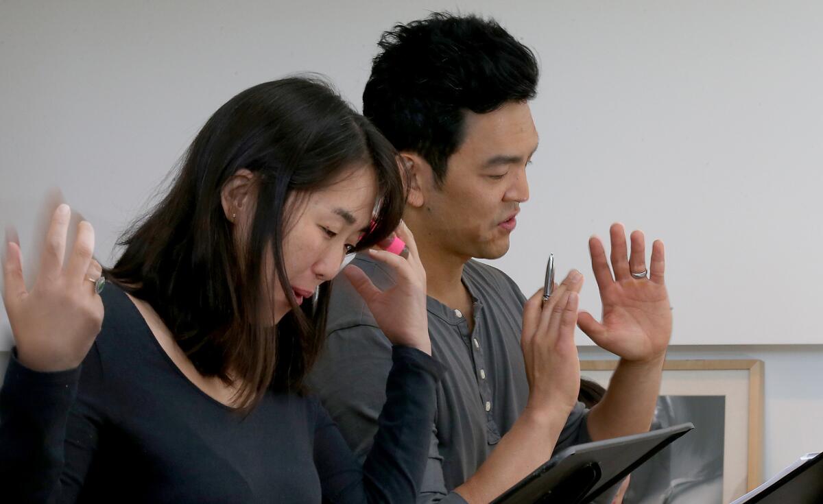 Actors Kerri Higuchi and John Cho during a recent reheasal. Artist at Play also holds a summer salon in which plays usually cast with white actors are presented as staged readings with Asian actors.