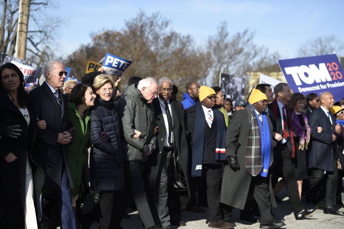 Most of the Democrats seeking their party's presidential nomination march in a Martin Luther King Jr. Day rally on Monday, Jan. 20, 2020, in Columbia, S.C.