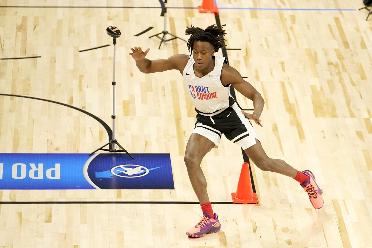 Illinois' Ayo Dosunmu runs the cone drill during the NBA draft combine.