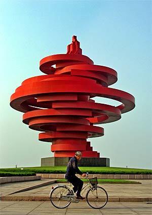 This torch-like sculpture titled "The Wind of May" is located near Fushan Bay in Qingdao, China, a popular vacation destination. The city is the beach capital of northern China, where the mainland meets the Yellow Sea. Qingdao, formerly known as Tsingtao, is also known for the beer that has been brewed in the city for more than 100 years. When the Olympics come to China this summer, the yachting events will be held in Fushan Bay.