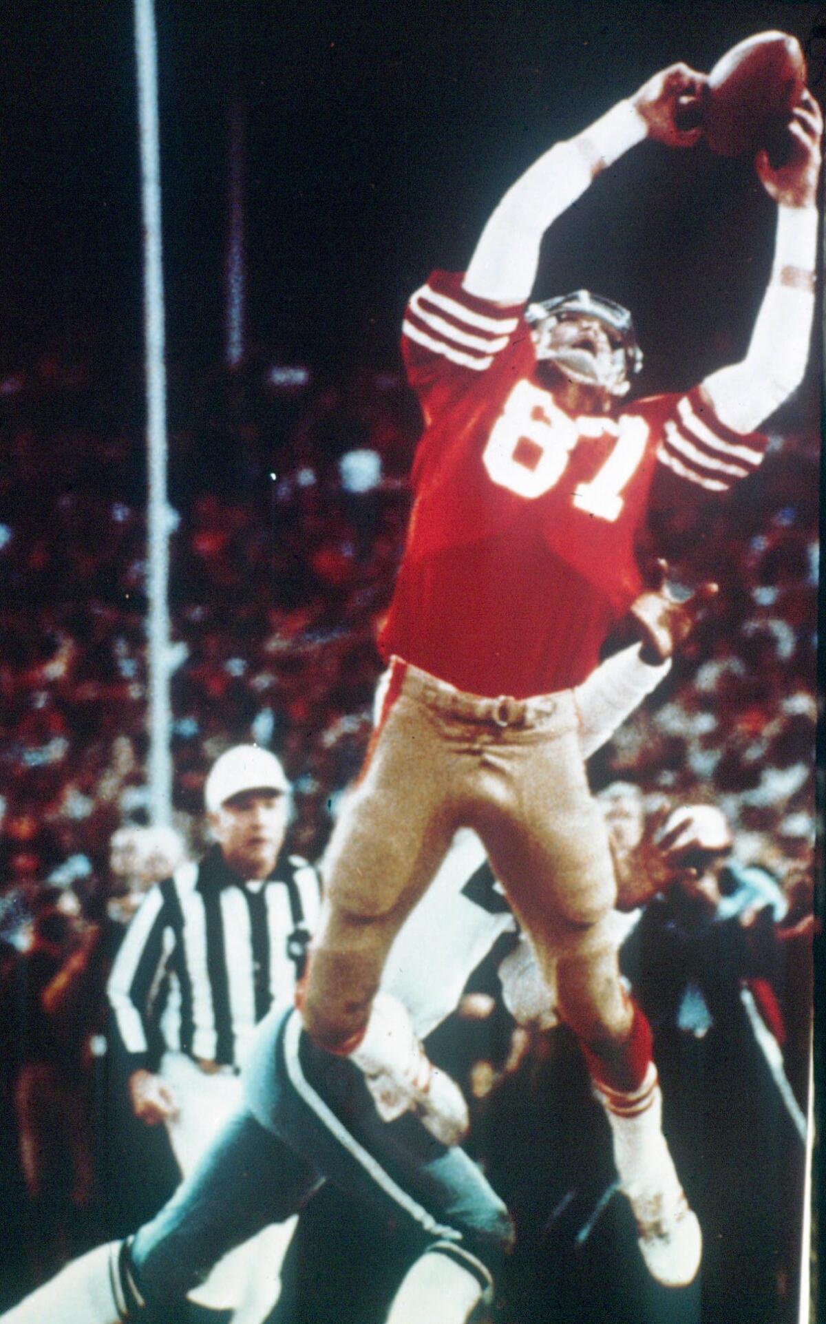 San Francisco 49ers wide receiver Dwight Clark leaps to grab a Joe Montana touchdown pass to beat the Dallas Cowboys on Jan. 10, 1982. "The Catch" sent the 49ers to their first Super Bowl.