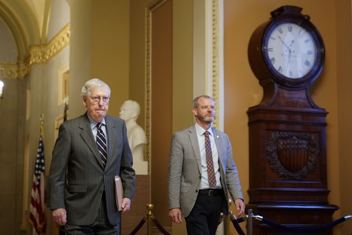 Senate Minority Leader Mitch McConnell of Ky., walks to the Senate Chamber on Capitol Hill in Washington, June 9, 2022. 
