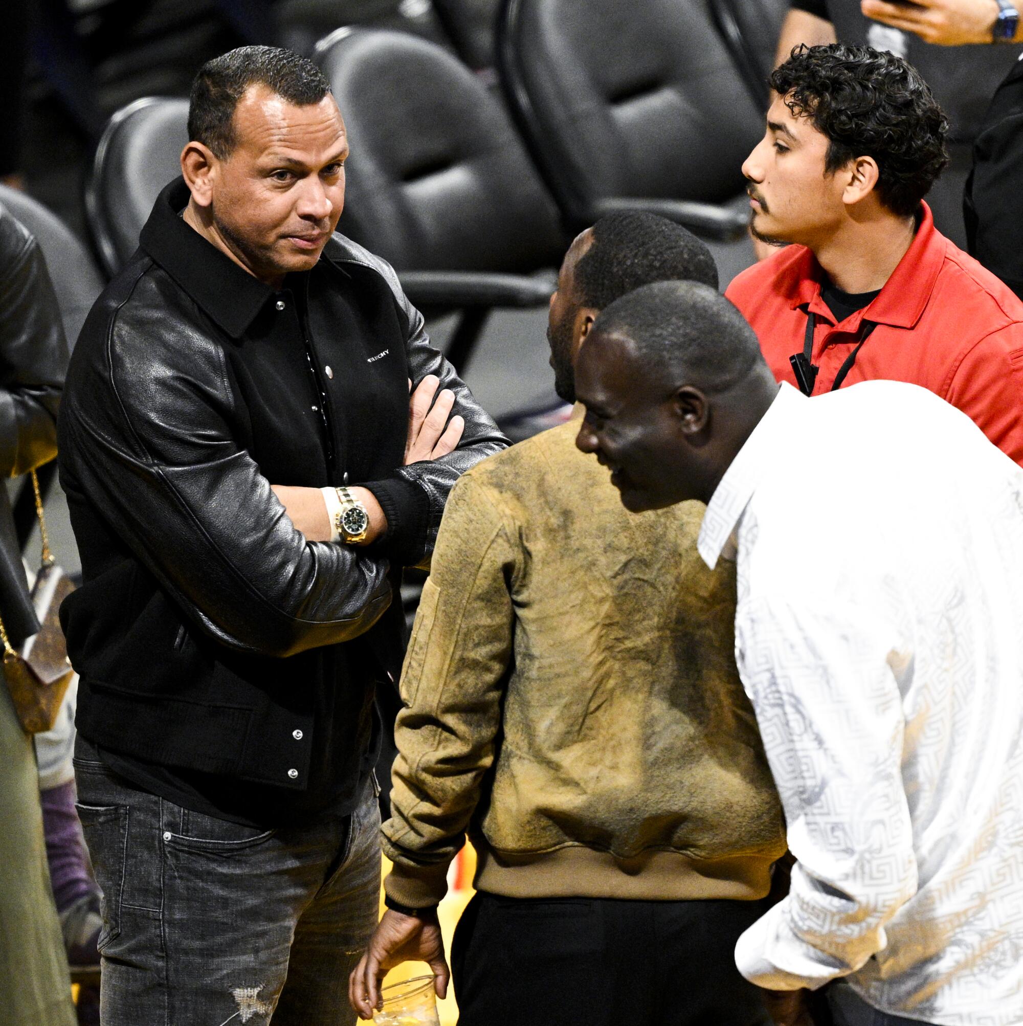 Alex Rodriguez speaks with Rich Paul during halftime of game four in the NBA Playoffs Western Conference Finals.