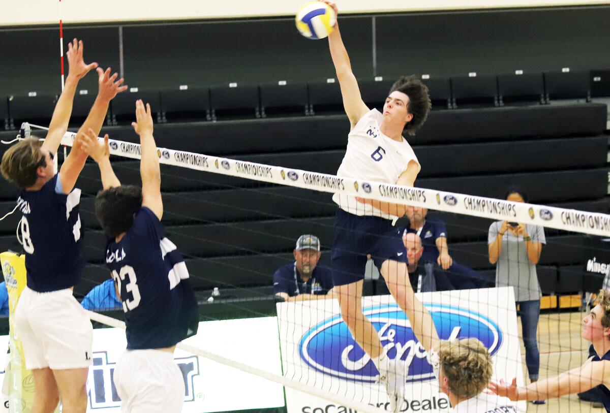Newport Harbor's Jake Read (6) spikes the ball during the Division 1 boys' volleyball final Saturday.
