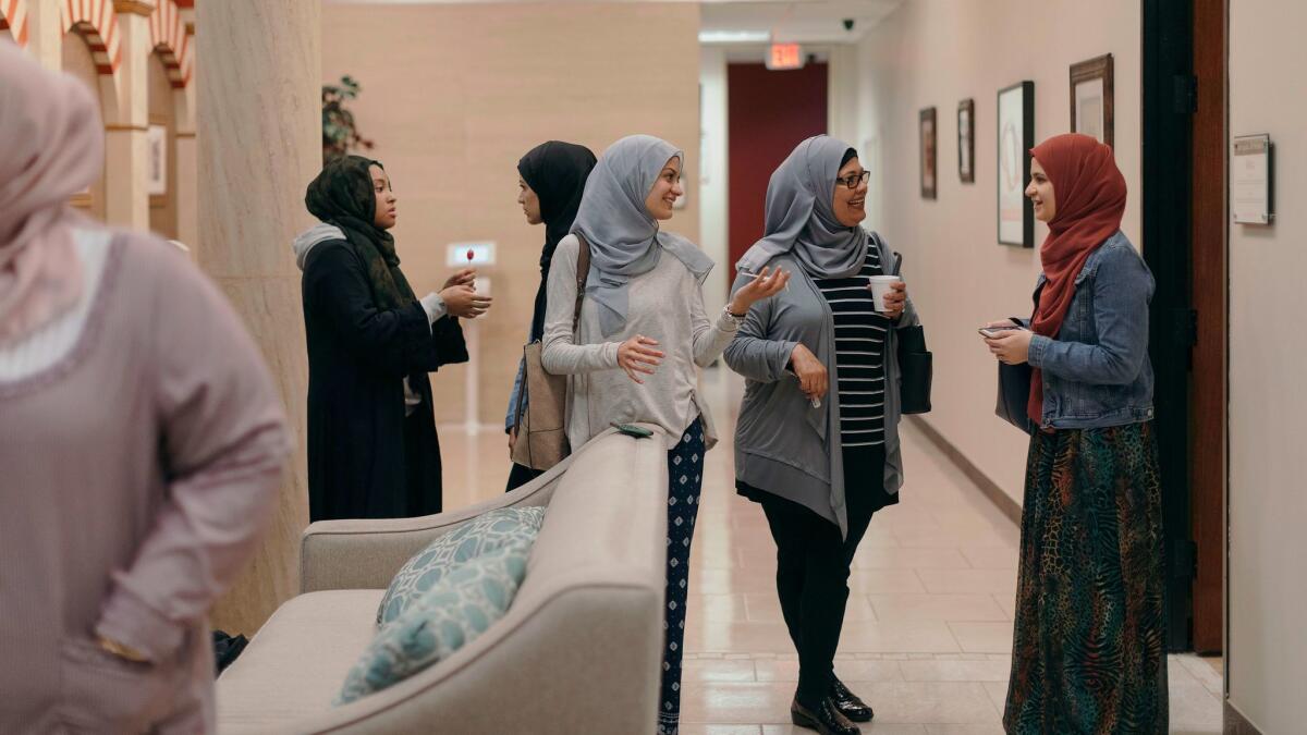 Members converse after prayer at Centro Islámico mosque in Houston.