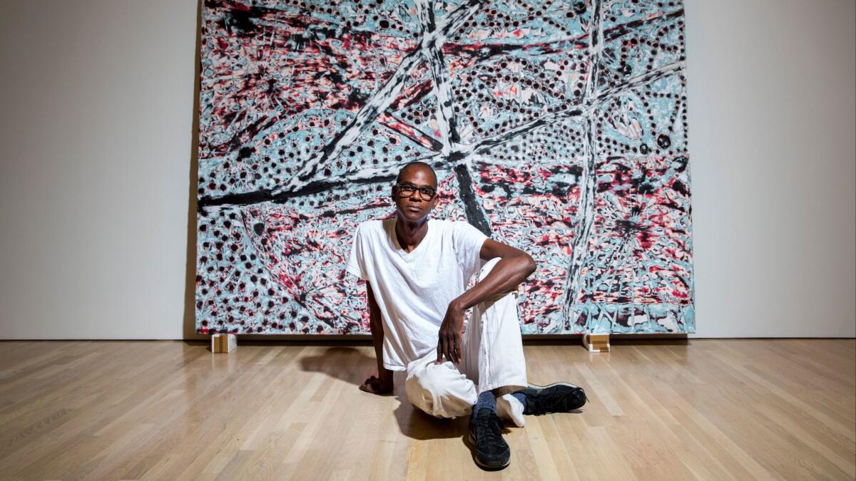 Mark Bradford installs a show at the Hammer Museum in 2015.